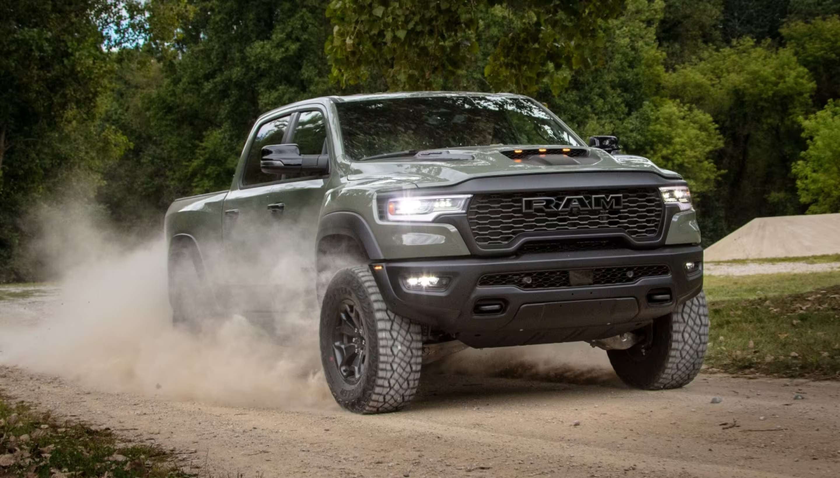 A RAM 1500 driving on a dirt road